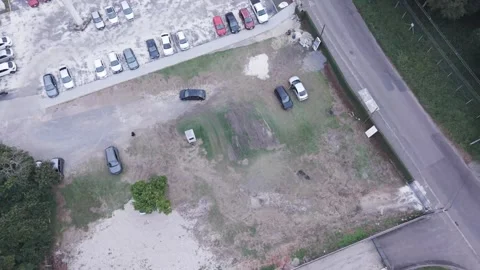 Drone view car maneuvering in parking lot gym urban traffic scene Stock-Footage 336643544