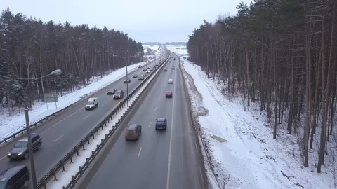 Drone view car moving on winter highway on background snow forest Stock Footage 86359508