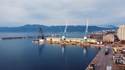 Drone view of the cargo seaport and huge port cranes. Handling dock for ships Stock Footage 281362558
