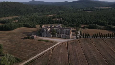 Drone view of castle Abbey of San Galgano in Italian Tuscany at sunset Stock Footage 159305976