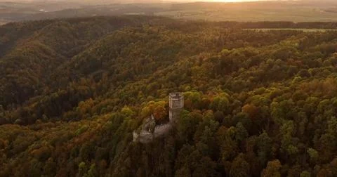 Drone View of a Castle Hidden in a Lush Forest Stock Photos
