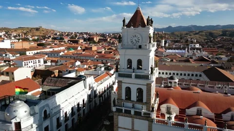 Drone View of Cathedral Basilica Tower in Sucre, Bolivia with Mountain Backdrop Stock Footage 295291930