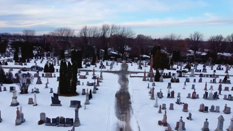 Drone view cemetery winter day tombstones the path have a shape of a cross 4K Stock Footage 204823243
