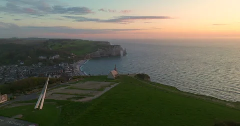 Drone view of the chalk cliffs on the seashore. People walk along the green Stock-Footage 240722424