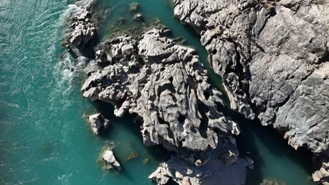 Drone view of chocolate rocks and river in pakistan Stock Footage 345804646