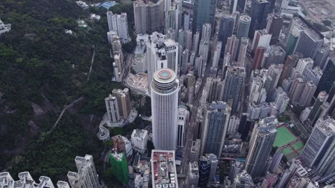 Drone view of a circular building in Hong Kong Stock Footage 275007989