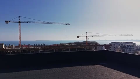 Drone view of city development and tower cranes Vídeos de archivo 338221050