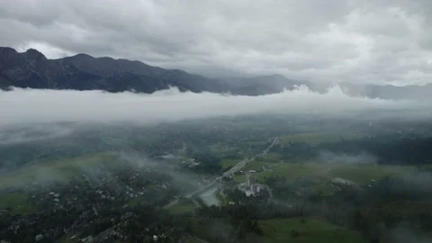 Drone view of the city in mountains the clouds, 4k 10 bit Stock Footage 222955181