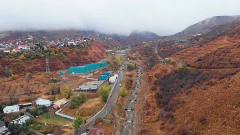 Drone view of city in mountains with river in autumn period. Almaty in autumn Video stock 229398634