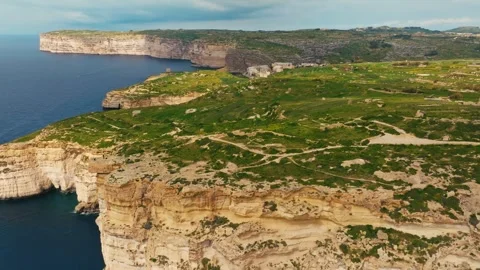 Drone view of cliffs on Gozo island. Rocks, sea, greeny. Maltese island Stock Footage 329983826