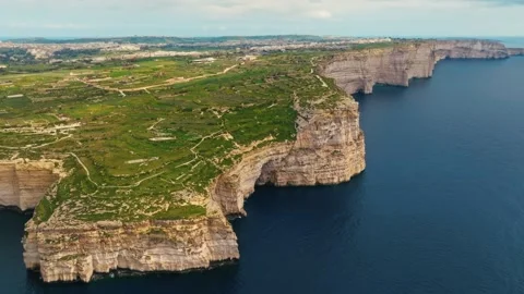 Drone view of cliffs, Gozo island. Green fields, rocks, sea. Malta Stock Footage 329988134
