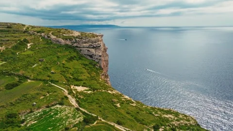 Drone view of cliffs, green hills on Gozo island. Rocks, sea. Malta island Vídeos de archivo 329989544