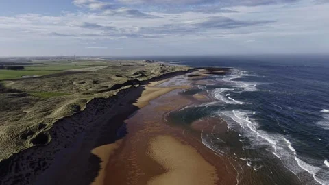 Drone View of Cliffs, Sandbar and Waves Along Scenic Coastline Video stock 333784414