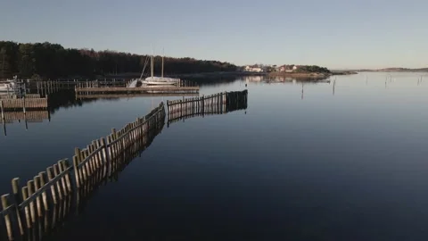 Drone view close over calm water one cold winter morning Stock Footage 145869395