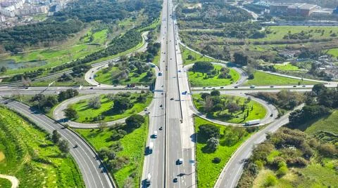 Drone view of cloverleaf interchange. Highway road junction. Portugal, Almada Stock Photos