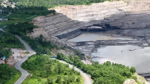 A drone view of a coal mine right next to the highway, featuring a very dee.. Stock Footage 343254209