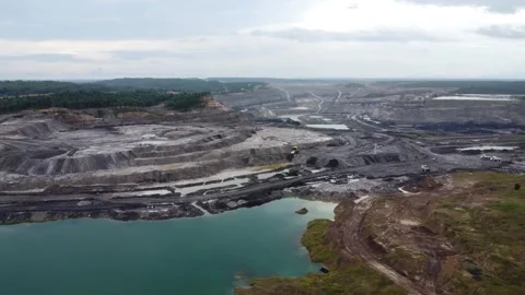 Drone view of coal mining activities, coal transport trucks loading and spr.. Stock Footage 328970137