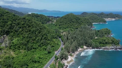 Drone View of a Coastal Highway Winding Through Tropical Hills Stock Footage 342577016