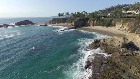 Drone view of coastline and beach of Laguna Beach aerial flyover Stock Footage 73719230