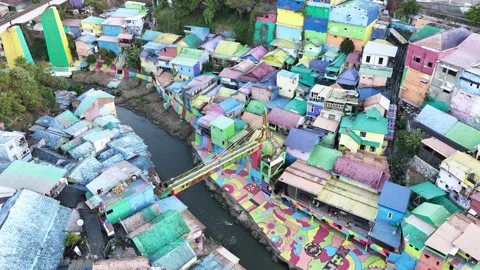 Drone View of Colorful Riverside Community with Painted Streets Stock Footage 340542614