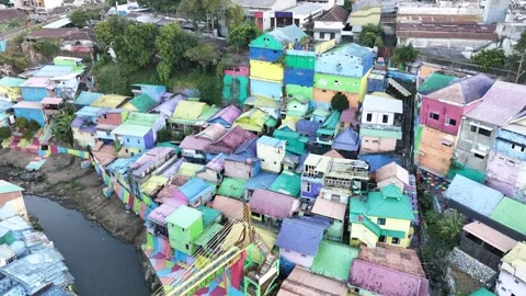 Drone View of Colorful Riverside Community with Painted Streets Stock Footage 340542631