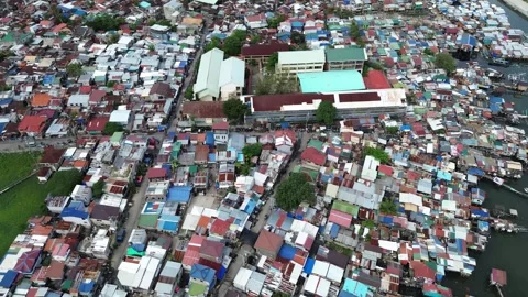 Drone view of compact residential area and rooftops in Cebu Philippines 35 Stock Footage 334056316