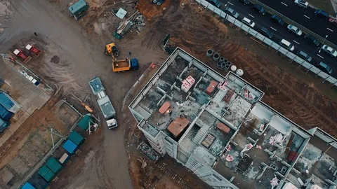 Drone view construction site and roofs, delivery concrete structures and Stock Footage 124890574