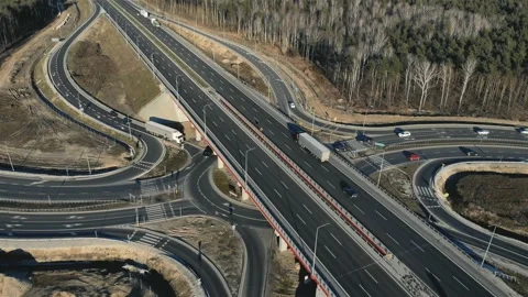 Drone view of contemporary elevated highway intersection with vehicles in Vidéo 132733841