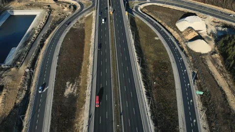 Drone view of contemporary elevated highway intersection with vehicles in Vidéo 132734075