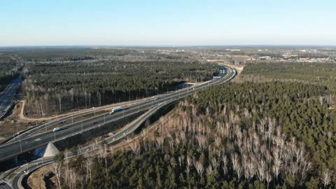 Drone view of contemporary elevated highway intersection with vehicles in Vidéo 132734501