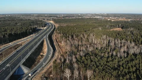 Drone view of contemporary elevated highway intersection with vehicles in Vidéo 132734852