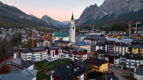 Drone view of Cortina d Ampezzo village in the Dolomites in Italy at sunrise Stock Footage 291554112