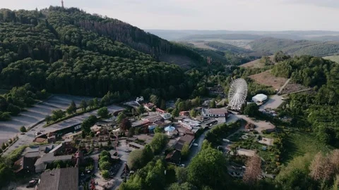 Drone view of countryside with ferris wheel in the hills in sunny weather Vídeo Stock 196836688