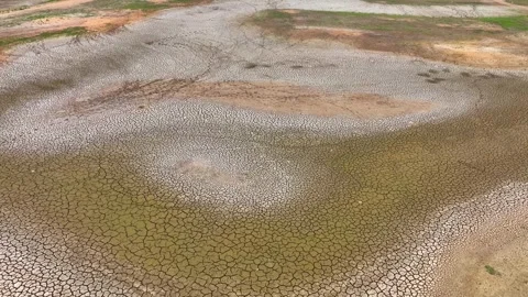 Drone view of cracked soil showing severe drought impact. Stock Footage 274375682