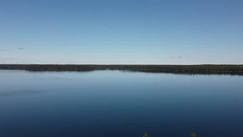 Drone view crane up of lake and forest in Manitoba in the summer Stock Footage 203230640