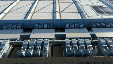 Drone view of critical cooling systems and industrial fans at a modern data Stock Footage 335024213