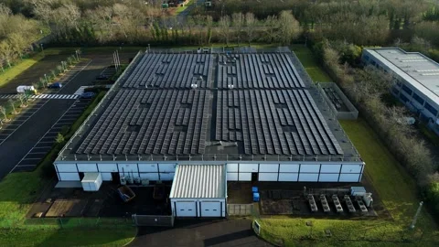 Drone view of a critical data facility in the UK with heavy-duty cooling fans Stock Footage 333022406