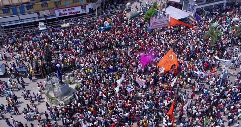 Drone view of crowd dancing joyfully with colors during immersion of lord G.. Stock Footage 340084363