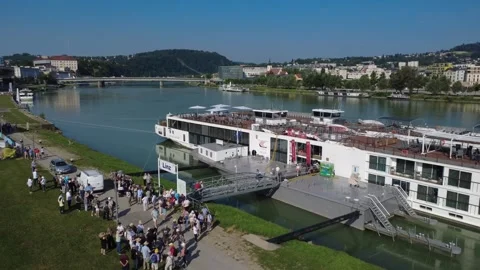 Drone View of Cruise Ship Docked in Linz With Passengers Disembarking Stock Footage 337823879