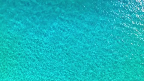 Drone view of the crystal clear texture of sea water near the Maldives. Видео 333777588