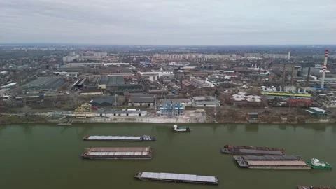 Drone view of Csepel chimneys emitting smoke beside the Danube under cloud Stock Footage 336468165