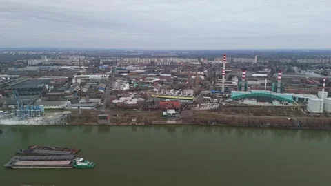 Drone view of Csepel's industrial zone with factories and docks by Danube Stock Footage 336468143