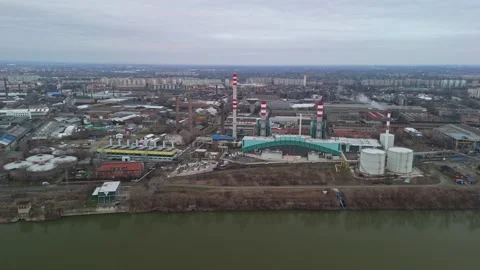 Drone view of Csepel's industrial zone along the Danube under overcast skies Stock Footage 336468198