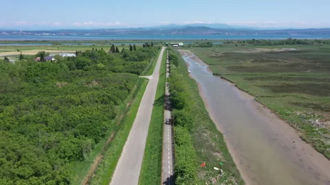 Drone view of a cycle lane in the grado's lagoon Stock Footage 263383097