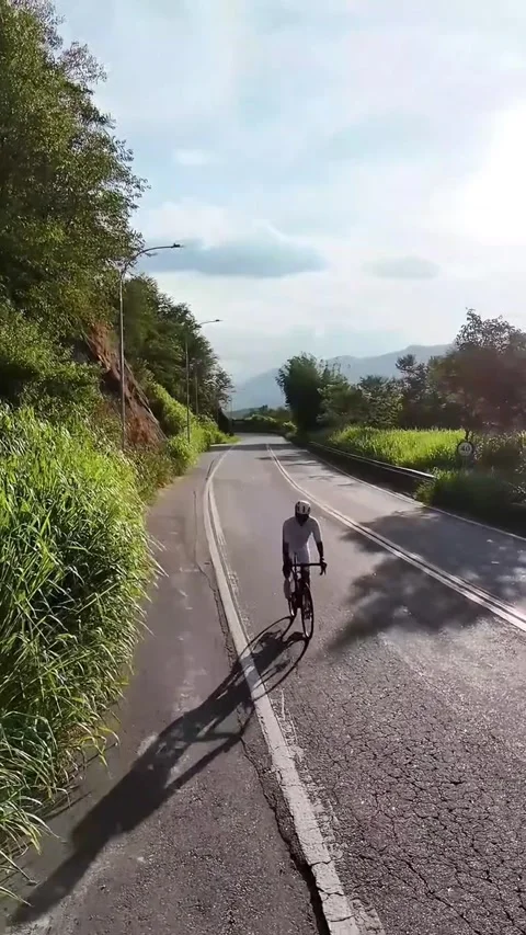 Drone View of Cyclist Climbing Mountain Road in Miguel Pereira, Brazil Stock-Footage 308674750