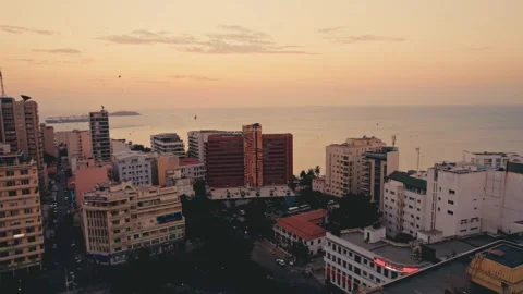 A drone view of Dakar coastal cityscape with buildings and greenery in Senegal Vídeo Stock 330987853