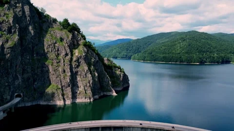 Drone view of a dam and mountain lake 스톡 동영상 318468237
