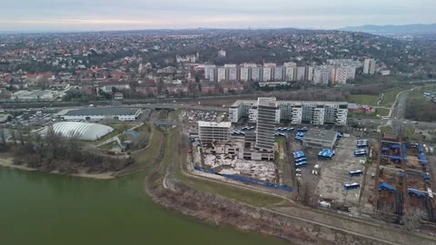 Drone view of the Danube beside Budafok housing, roads under an overcast sky Stock Footage 336468422