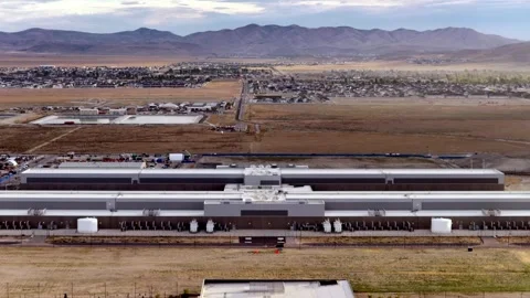 Drone View of a Data Center, Utah Town &amp; Mountains at Dusk Stock Footage 340353619