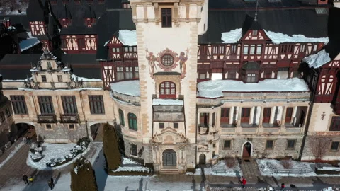 Drone view of the decorated central tower of Peles Castle in winter Stock Footage 321054738